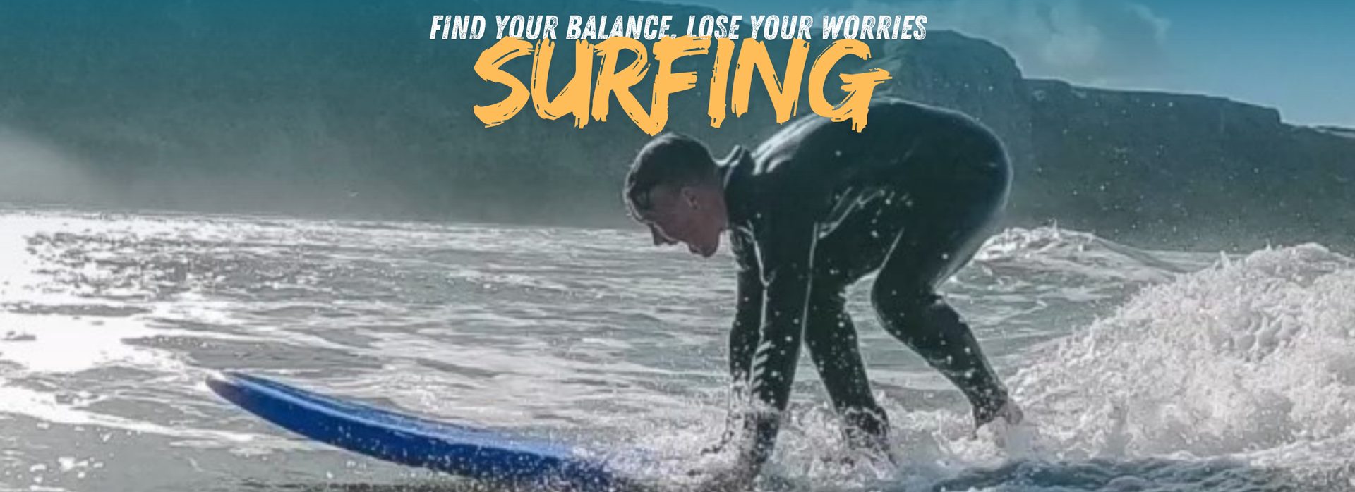 Surfing at Rhossili Beach